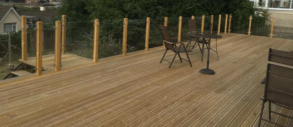 Completed timber decking with balustrades and garden furniture