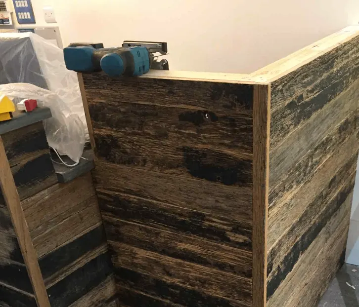 Bespoke timber reception counter during construction